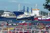 The image shows Spanish fishing vessels in port