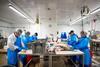 Workers at Steelhead Food Co processing facility