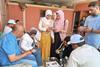 2.A group of trainees practicing assessment procedure on an Egyptian tilapia farm