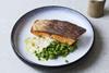 Crispy salmon with beurre blanc, crushed peas and parsley oil using salmon supplied by BAP-certified producer Hiddenfjord