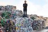 Tom Doman, Innovations Manager at Ecover on a bale of plastic waste