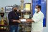 Mathew Joshua, head-executive relations, IBS Software, handing over the cheque to Trivandrum mayor, Mr K Sreekumar Photo: IBS Software
