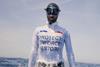 Alessia Zecchini, freediver, wearing a vest saying PROTECT! ENFORCE! RESTORE! to protest against French bottom trawling