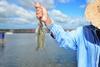 Fisher holding shrimp