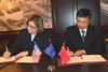 MDARD Director Clover Adams and Deputy Commissioner Xia Qianbao of the Ocean & Fisheries Bureau from the Jiangsu Province signing the MoU