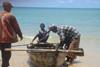 A fisherman prepares his boat for the sea