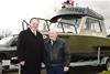 Fisheries and Oceans Minister, Keith Ashfield, with retired fishery officer, Max Tscharre, beside the Max Bay. The vessel was named after Mr Tscharre.