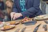 Someone cutting into seafood at the UK Seafood School in Grimsby