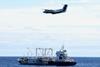 Canadian patrol aircraft overflying a fishing vessel and a carrier vessel on the high seas of the North Pacific Ocean. Photo: DFO