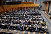 The image shows an overhead shot of the members attending the entry-into-force ceremony on 15 September