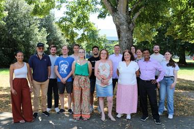 Members of Aviwell standing outside by trees