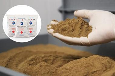 Austral Group fish meal in bag and a hand holding fish meal
