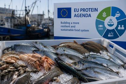 seafood on ice with a sign saying EU Protein Agenda in the background