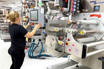 Image of workers operating linerless label machines