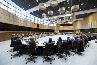 Delegates at a European Commission meeting sitting in a large oval