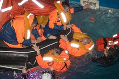Fishermen taking part in man overboard training