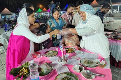 The photo shows attendees at the Matsya Mela meeting