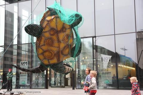 Greenpeace has previously used a giant turtle in a net outside John West's HQ to bring attention to unsustainable fishing methods