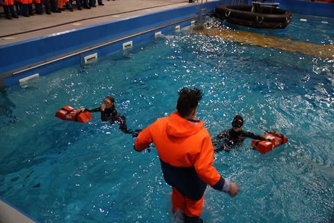 Fishermen being trained on survival skills in a purpose-built pool