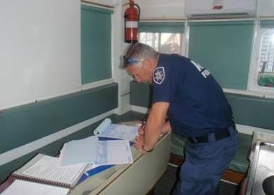 AFMA officer checking paperwork. Credit: AFMA 2014