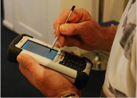 CMO Glenn Caravias from the Territory Force familiarising himself with a handheld data collection unit