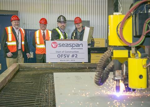 Employees at Vancouver Shipyards witness the first cut of steel