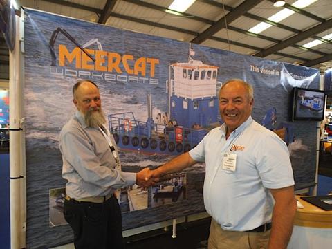 Murray Isles (left), on behalf of Huon Aquaculture with Peter Smith, managing director of Meercat