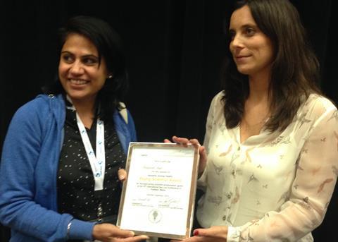 Marta Gameiro, Global Technical Services Manager for NAH Aqua, congratulates Kiranpreet Kaur on receiving the Young Scientist Award