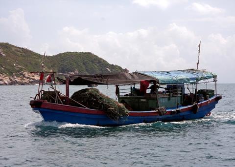 Small fishing boat in Sanya, China. Credit: David Castor