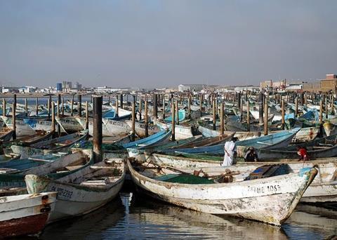 Local fishing boats in a West African port. The industry is suffering due to a massive amount of illegal fishing and under-investment in the region