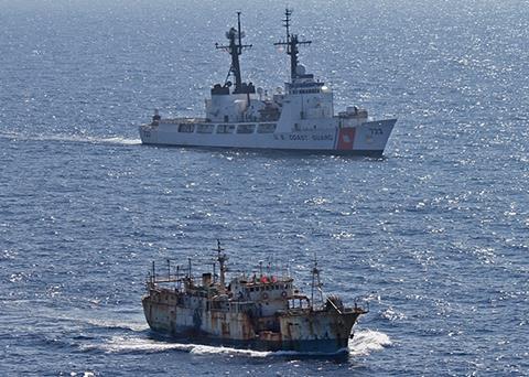 The crew of the Coast Guard Cutter Rush escorts the suspected high seas drift net fishing vessel Da Cheng in the North Pacific Ocean on 14 August 2012. Credit: U.S. Coast Guard