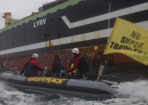 Greenpeace activists on an inflatable boat intercepted the world’s second largest factory fishing trawler, the FV ‘Margiris’. © Greenpeace