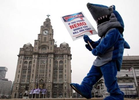 Greenpeace protestor outside Princes HQ. Credit: Greenpeace