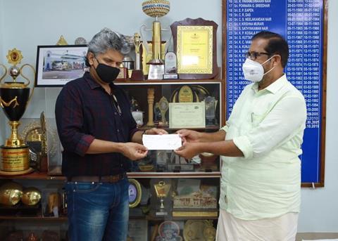 Mathew Joshua, head-executive relations, IBS Software, handing over the cheque to Trivandrum mayor, Mr K Sreekumar Photo: IBS Software