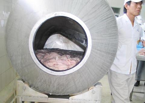 The drum used for tumbling pangasius fillets in STPP solution in a Vietnamese processing plant