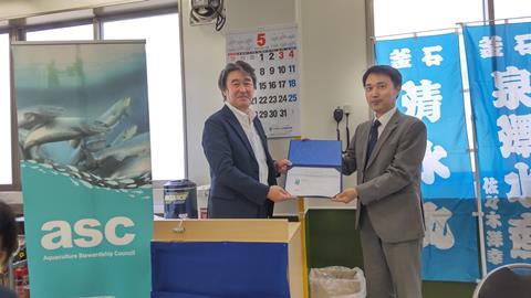 President Hiroshi Izumisawa with Amita at the presentation ceremony