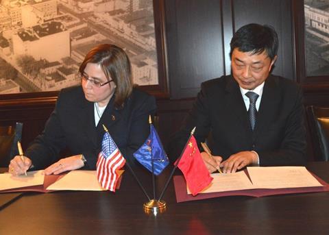 MDARD Director Clover Adams and Deputy Commissioner Xia Qianbao of the Ocean & Fisheries Bureau from the Jiangsu Province signing the MoU