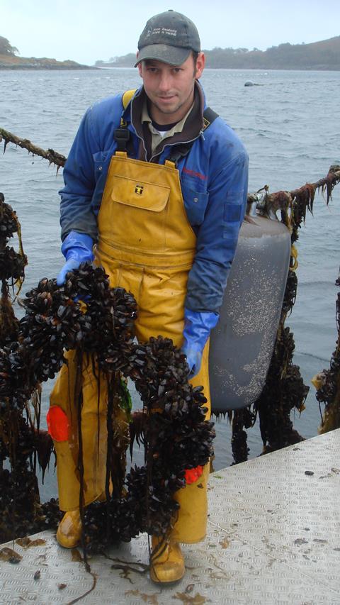 One of the Scottish Shellfish Marketing Group members, Cameron Maclean of Mull, with a rope of cultivated mussels