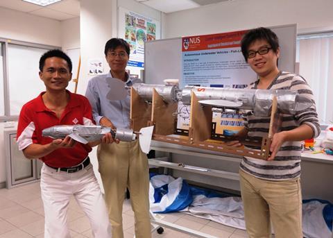 The team (Professor Xu Jianxin, Fan Lupeng and Dr Ren Qinyuan) with the robot fish. Credit: National University of Singapore
