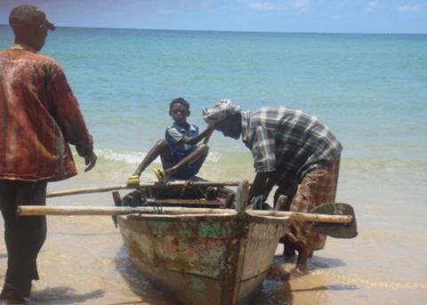 A fisherman prepares his boat for the sea