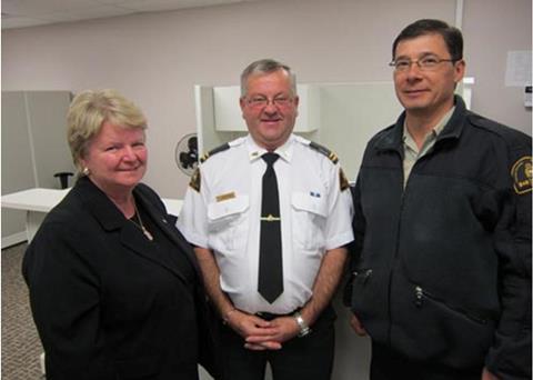 Minister of National Revenue and Member of Parliament for Egmont , the honourable Gail Shea at the new location of the Catch Certification Program Operations Centre in Tignish, Prince Edward Island with fishery officers Louis Richard (centre), a...