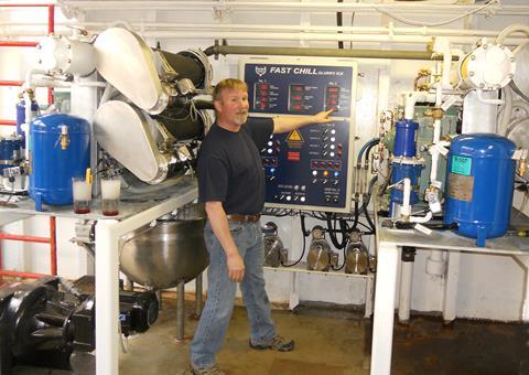 Jerry Downing of B & N Fisheries onboard the Intrepid Explorer explains the control panel for the two FastChill FC 400 slurry ice machines