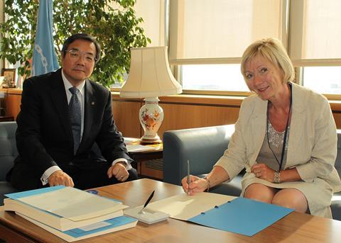 IMO Secretary-General, Koji Sekimizu, with Ms Ida Skard, Director General, Maritime Department, Ministry of Trade and Industry, Norway, who is signing the Cape Town Agreement of 2012 on Monday 15 July 2013