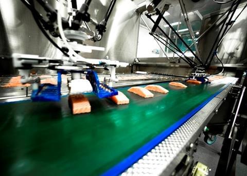 Marel's portioning and robot loading solution enables a semless flow of salmon portions