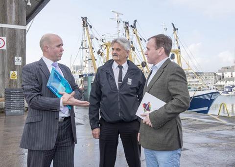 Jason Schofield, chief executive of Sutton Harbour Holdings plc, Pete Bromley, manager of Plymouth Fisheries, and George Eustice MP, Defra Minister