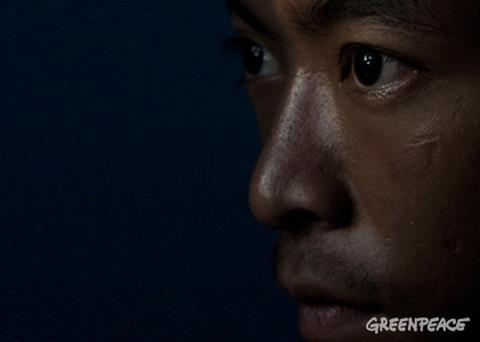 21 year old worker forced to work on a fishing boat with no way to return to his homeland. © Ardiles Rante/Greenpeace