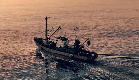 EU fishing boat at sunset