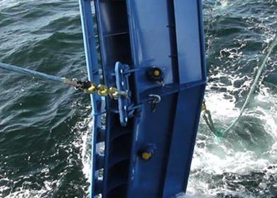 The Thyborøn trawl door, with a distance sensor and a pitch, roll and height sensor underneath, while testing environmentally safer trawling methods in the North Sea