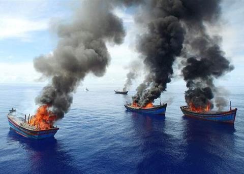 Four Vietnamese boats were burnt in June after Palau authorities caught them fishing illegally. © Jeff Barabe for The Pew Charitable Trusts