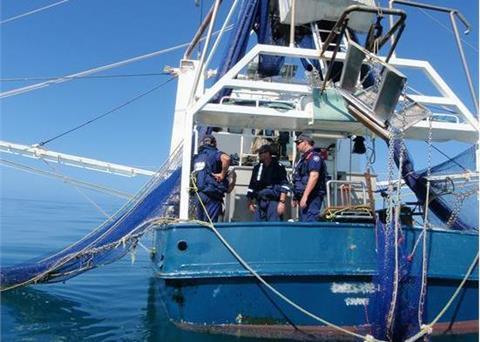 AFMA fisheries officers inspecting a vessel operating in the Northern Prawn Fishery in the Gulf of Carpentaria